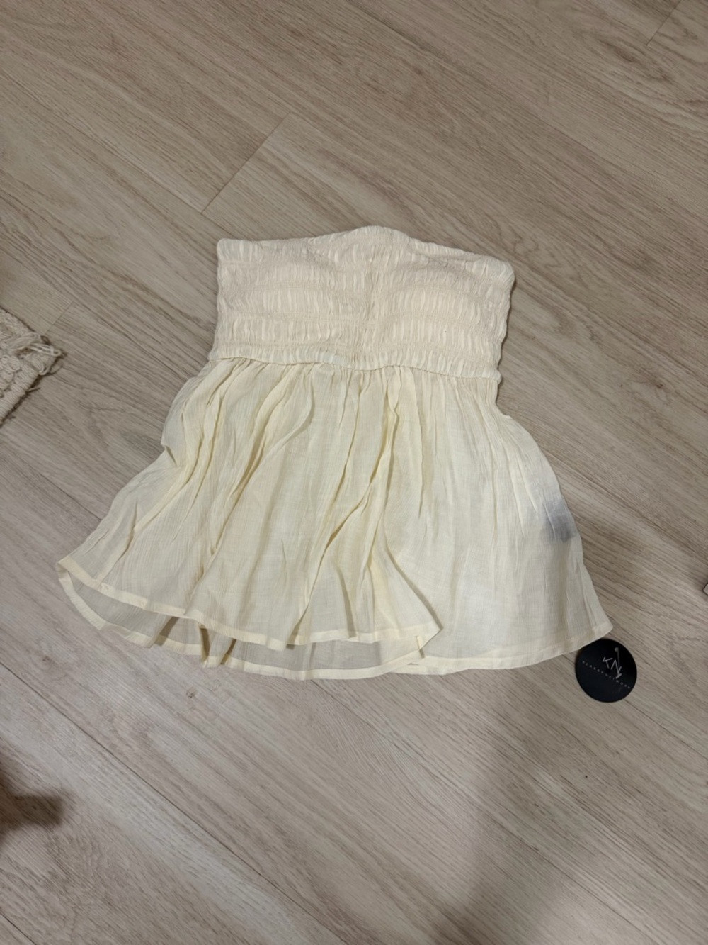Klassy Network Strapless Cream Smocked Peplum Camisole